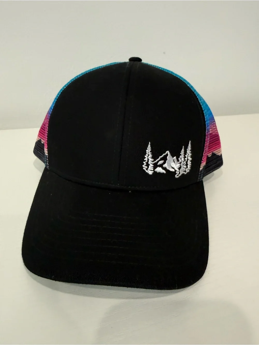 Black Trucker Hat with Mountain & Trees Embroidery and Colorful Mesh; worn 1x.